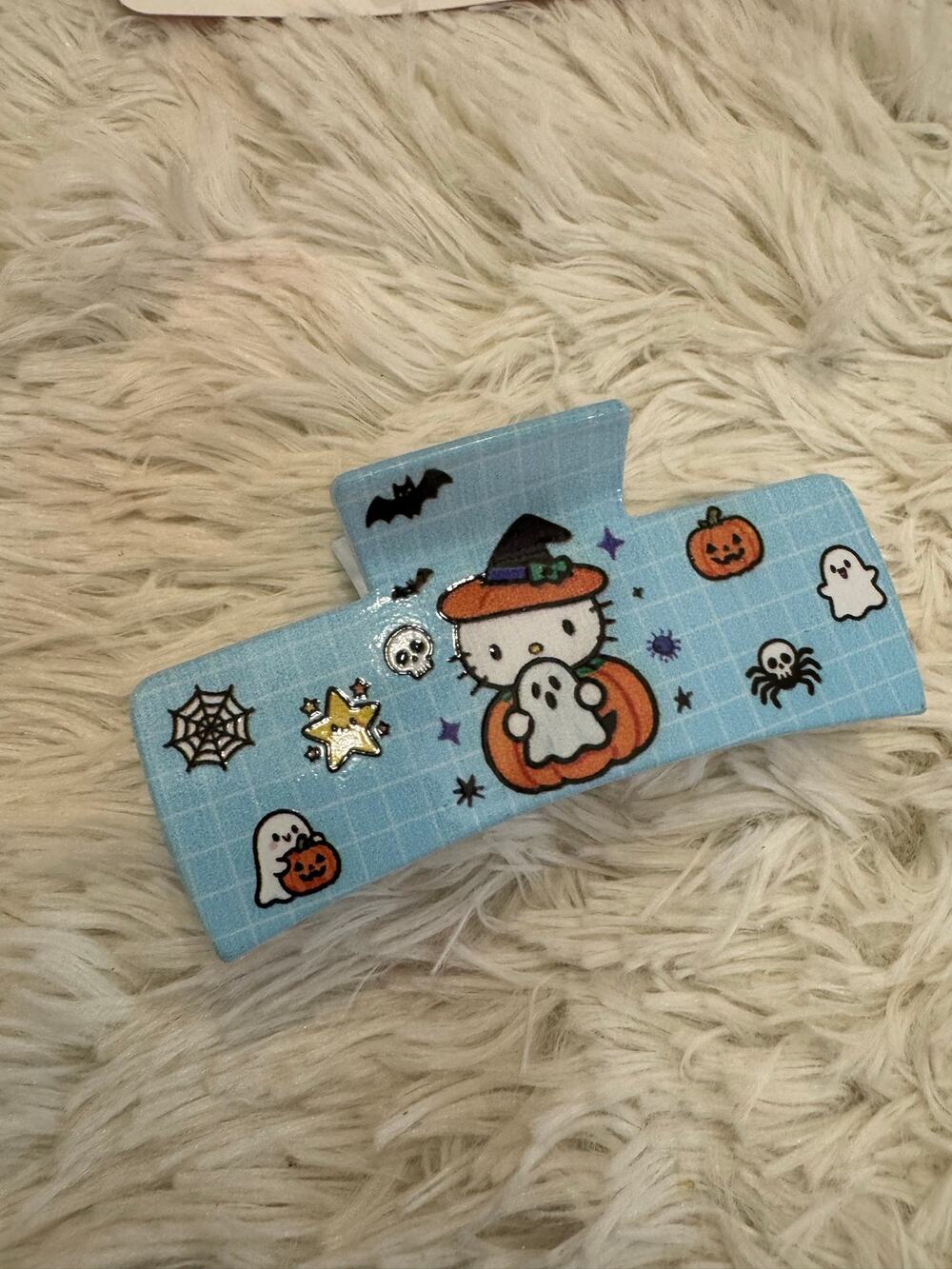 Hello Kitty Halloween hair clip witch hat pumpkins, ghosts blue grid background
